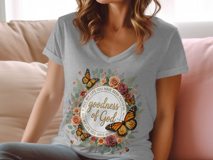 Gray t-shirt with "Goodness of God" text and floral butterfly wreath.