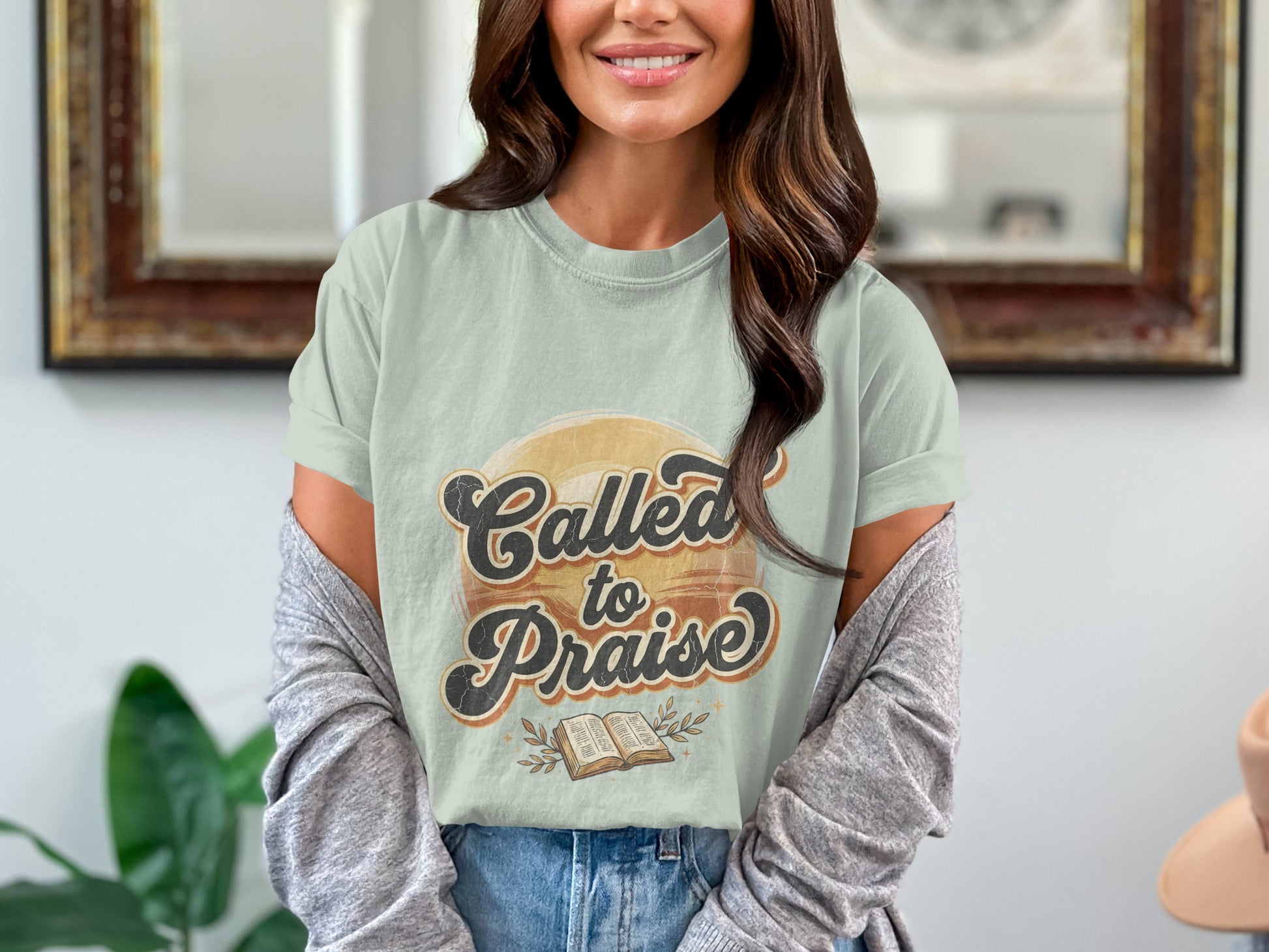 Light green t-shirt with "Called to Praise" text and an open book graphic.