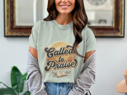 Light green t-shirt with "Called to Praise" text and an open book graphic.