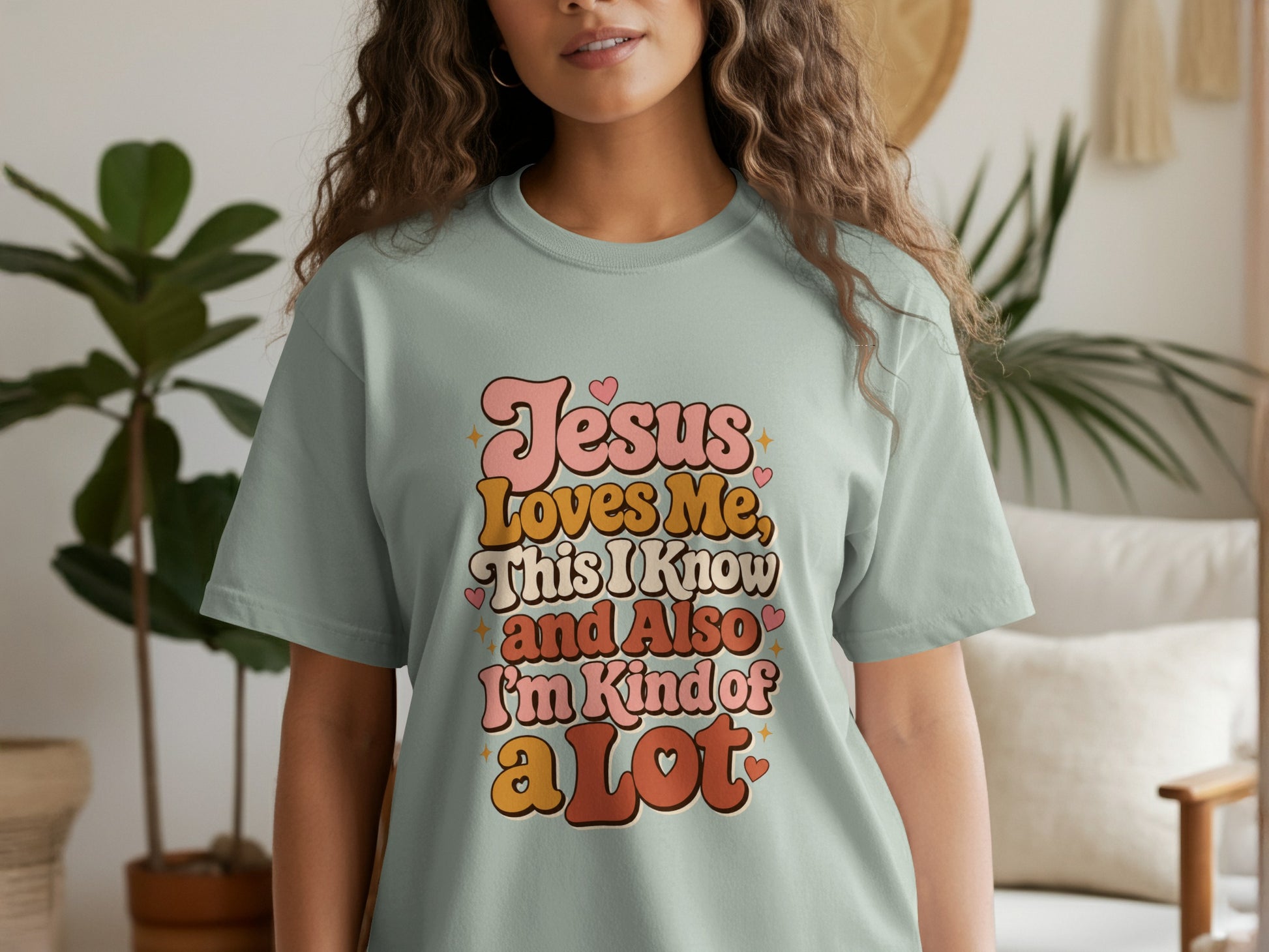 Pale green t-shirt with text "Jesus Loves Me, This I Know and Also I'm Kind of a Lot".