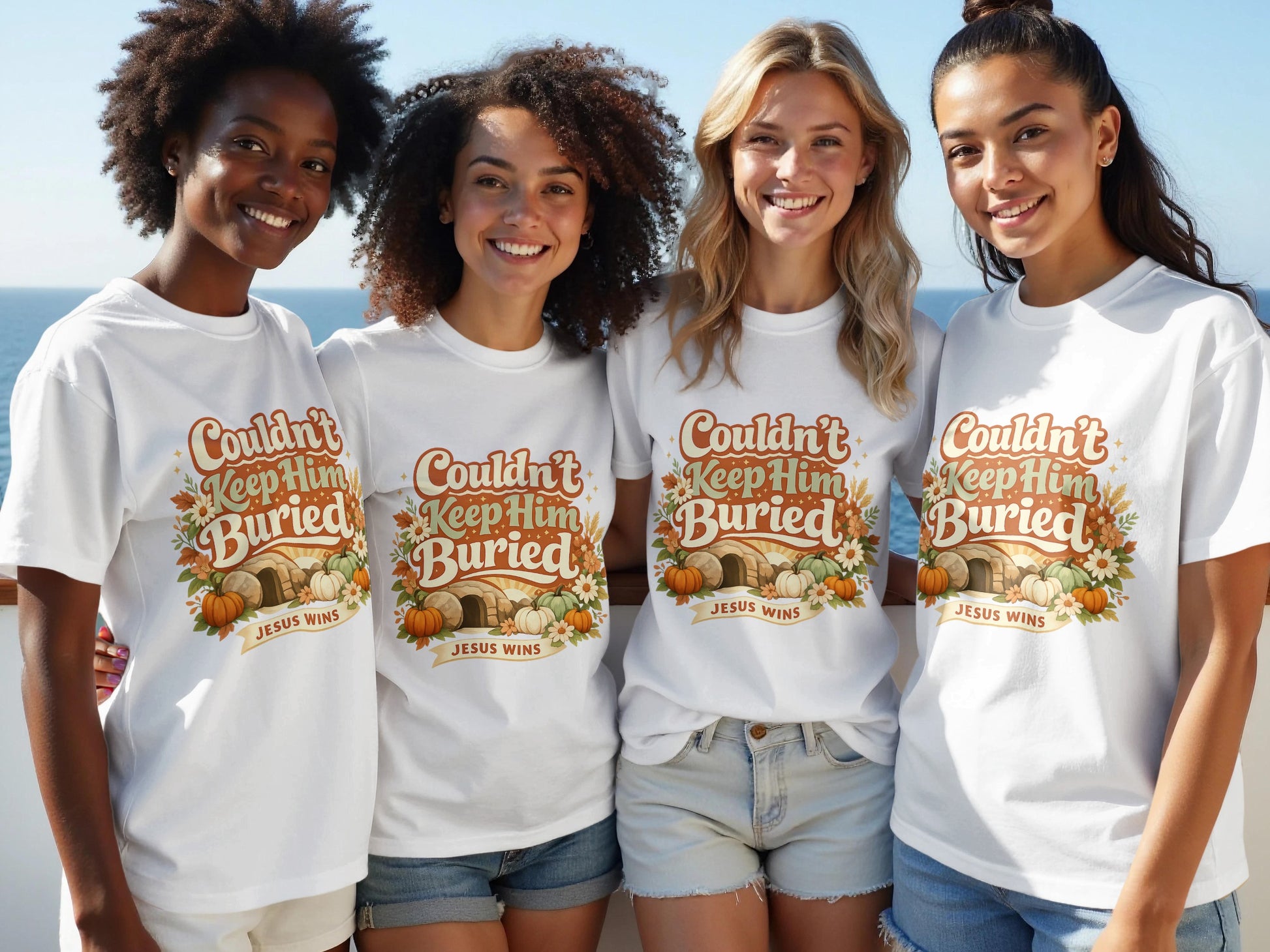 Four women model white t-shirts with text "Couldn't Keep Him Buried JESUS WINS".