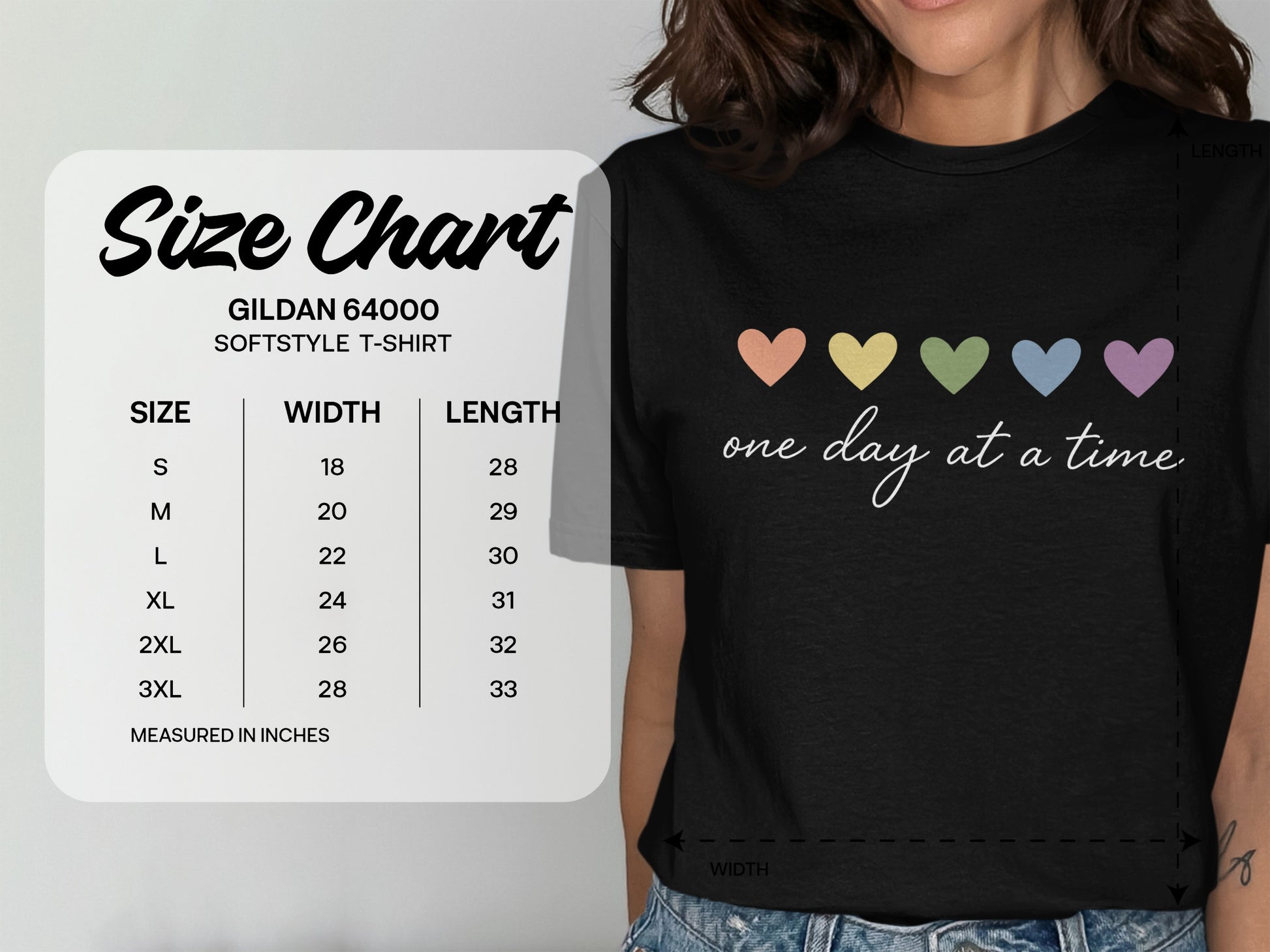 Gildan 64000 Softstyle T-shirt size chart with hearts and "one day at a time" text.