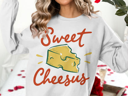 White sweatshirt with "Sweet Cheesus" text and cheese graphic.