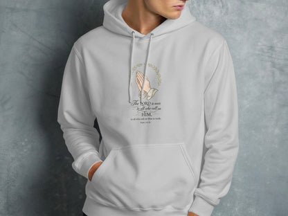 White hoodie with prayer hands and Psalm 145:18 verse.