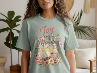 Light green t-shirt with "Joy Comes in the Morning" lettering and floral design.