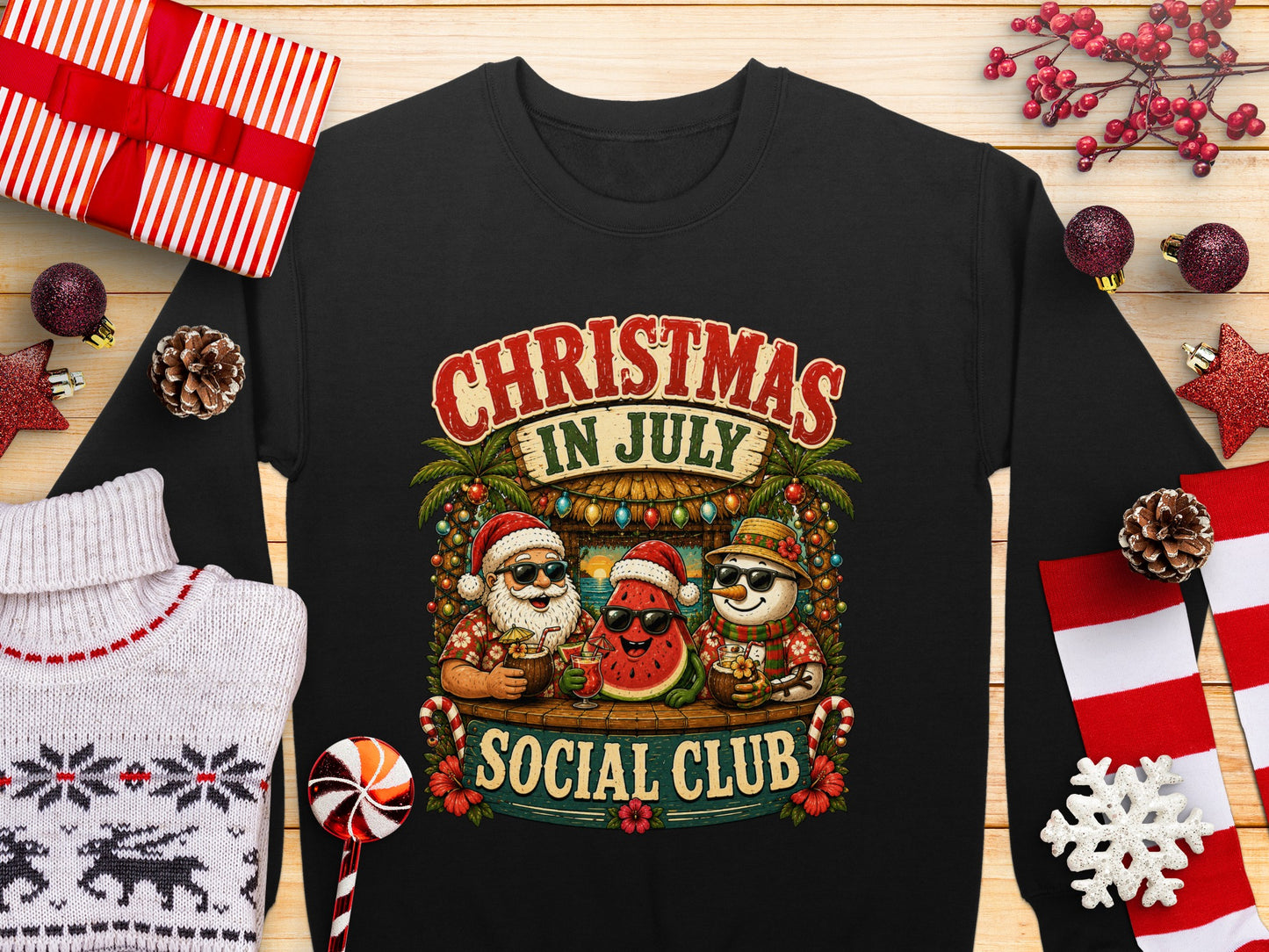 Christmas in July Social Club sweatshirt featuring watermelon and Santa characters.