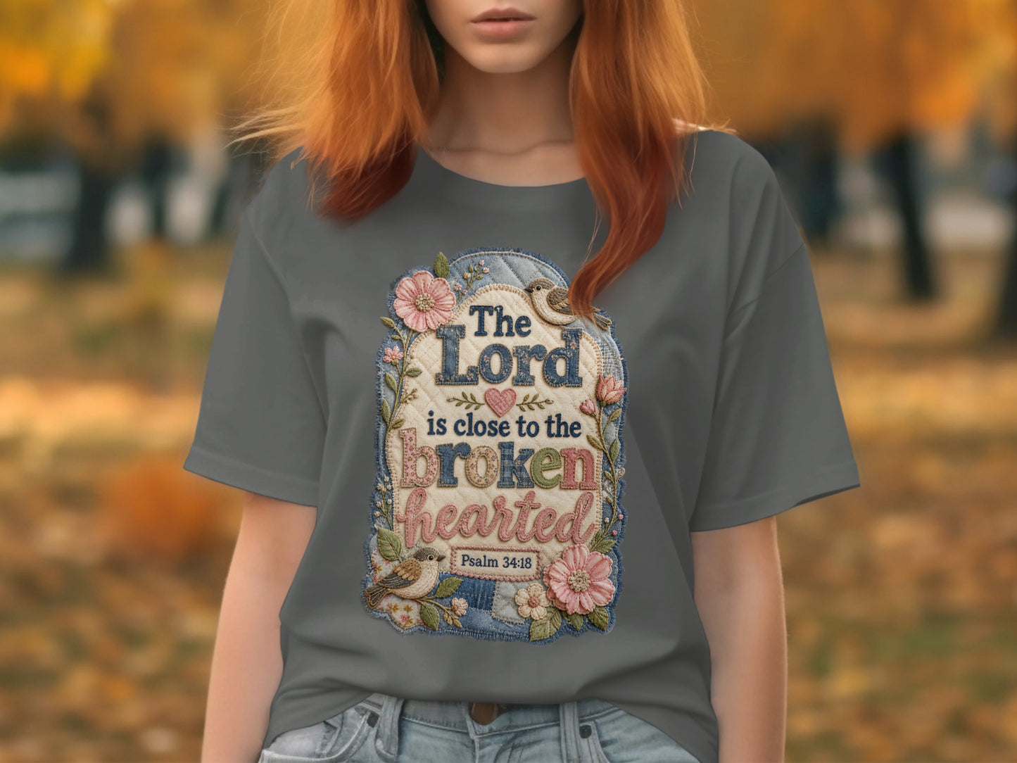 T-shirt with floral design, birds, and "The Lord is close to the brokenhearted Psalm 34:18".
