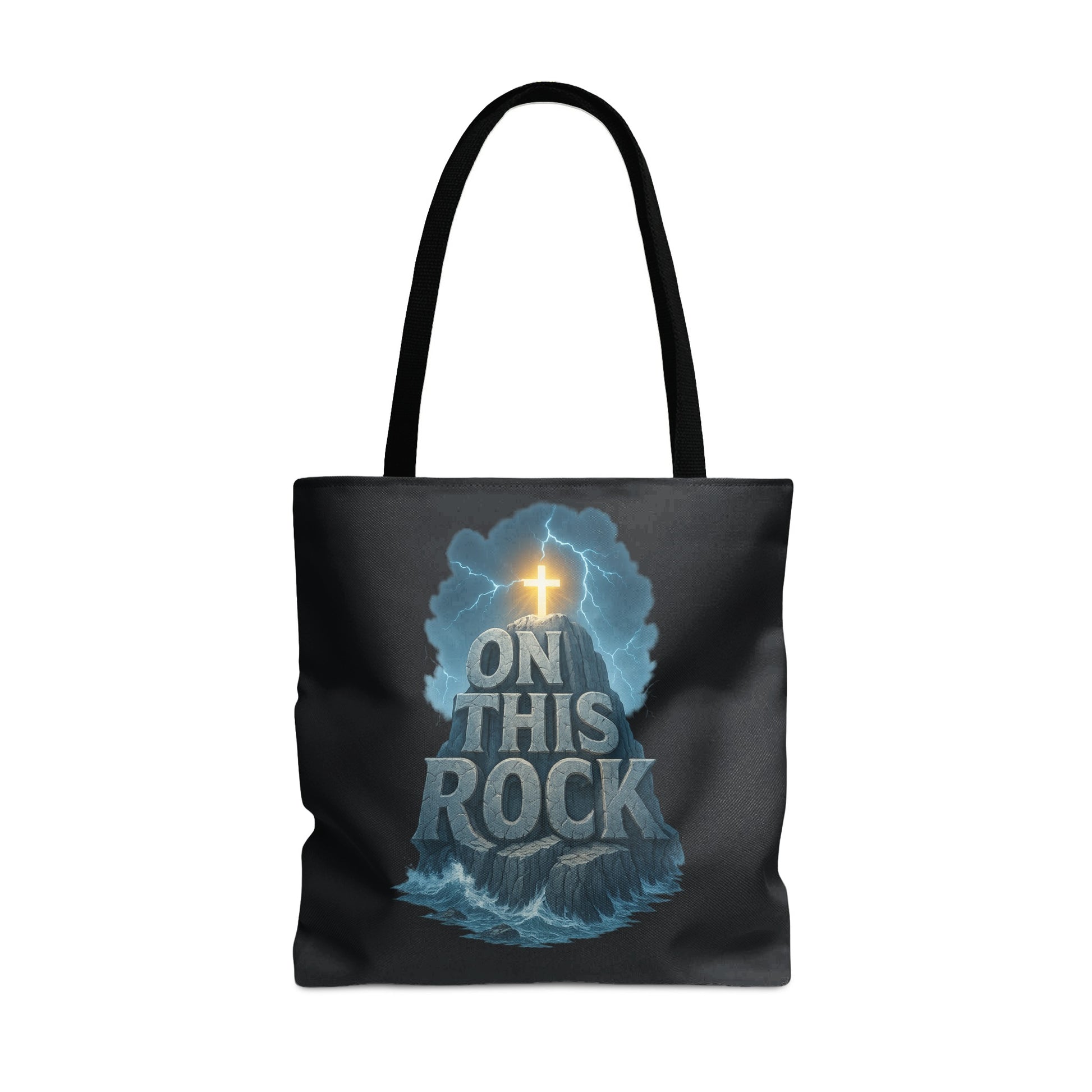 Black tote bag with the phrase "ON THIS ROCK" over a rock formation and cross.