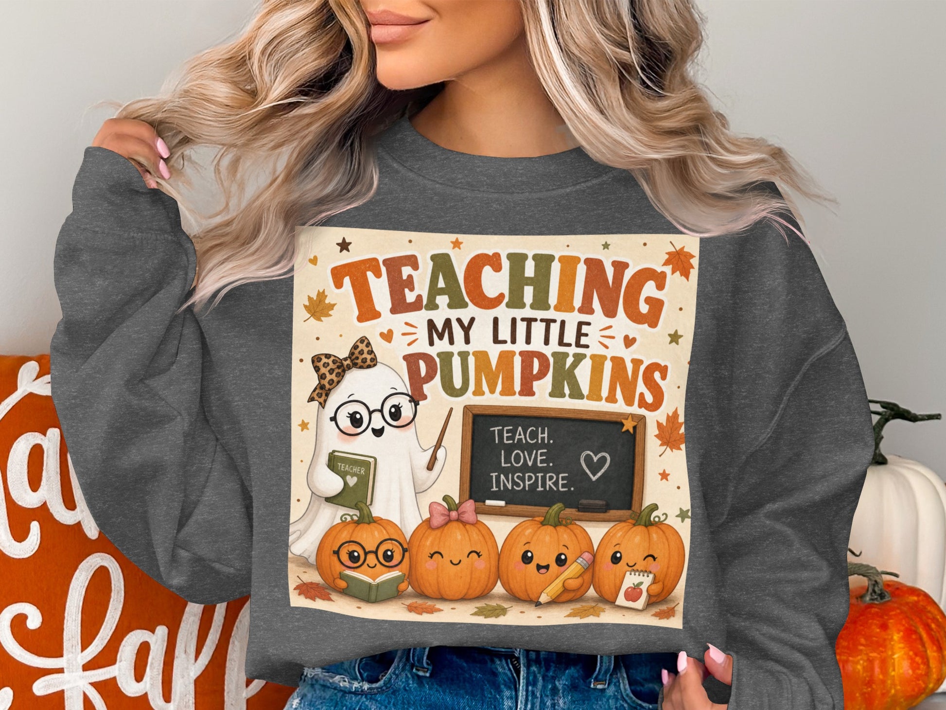 "Teaching My Little Pumpkins" ghost and pumpkins graphic on a grey sweatshirt.