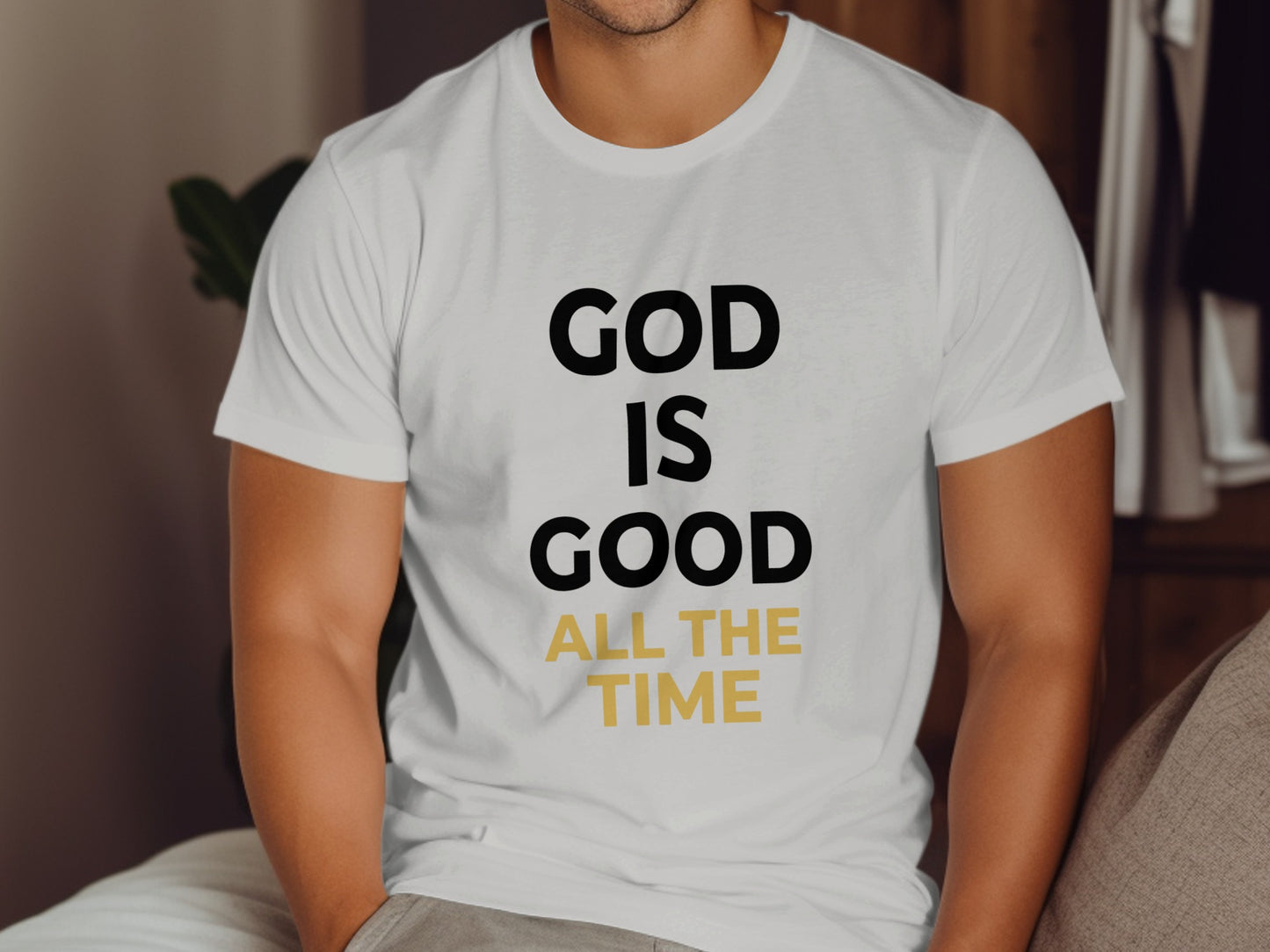 White t-shirt with "GOD IS GOOD ALL THE TIME" text in black and gold.