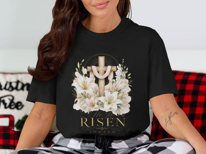 Black t-shirt with a wooden cross, lilies, and "He Is Risen Indeed" text.