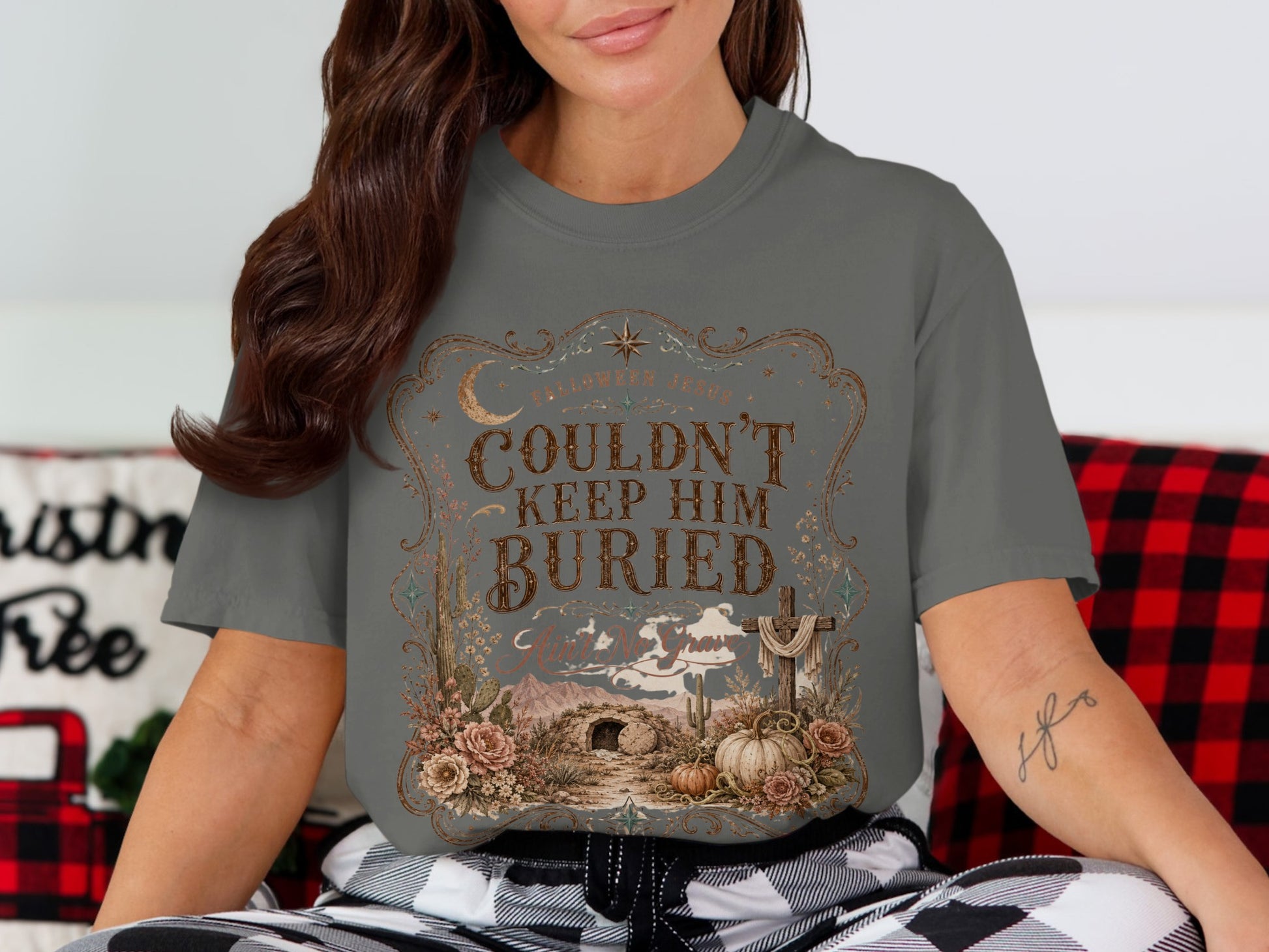 Graphic tee with "Couldn't Keep Him Buried" text and a tomb scene.