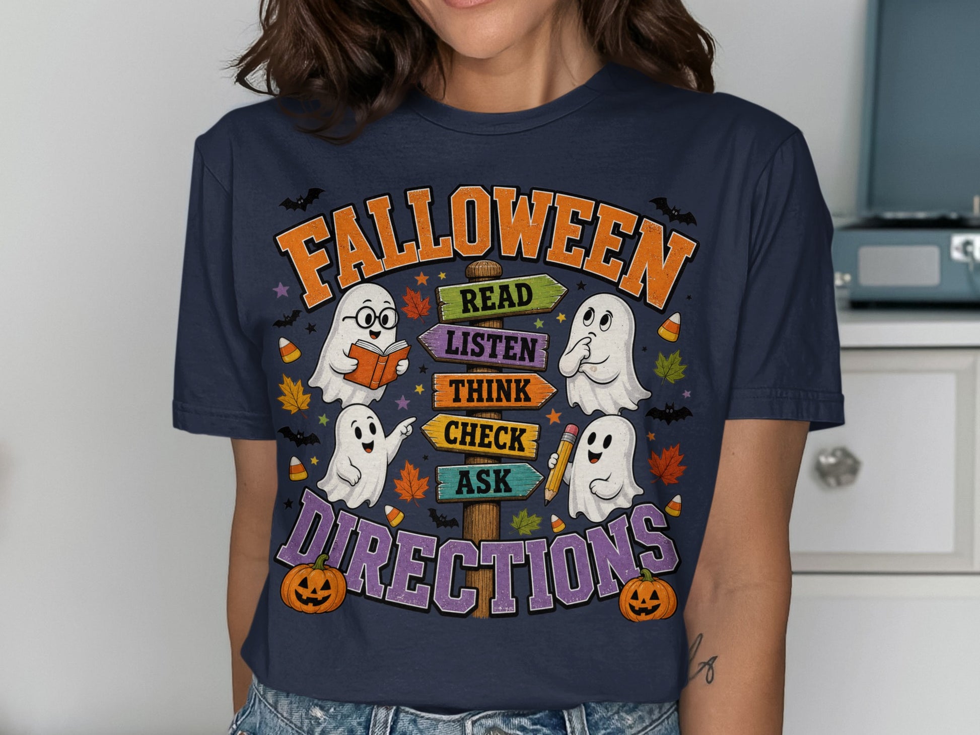 "Falloween" t-shirt with ghosts and directional signs for "Read", "Listen", "Think", "Check", "Ask".