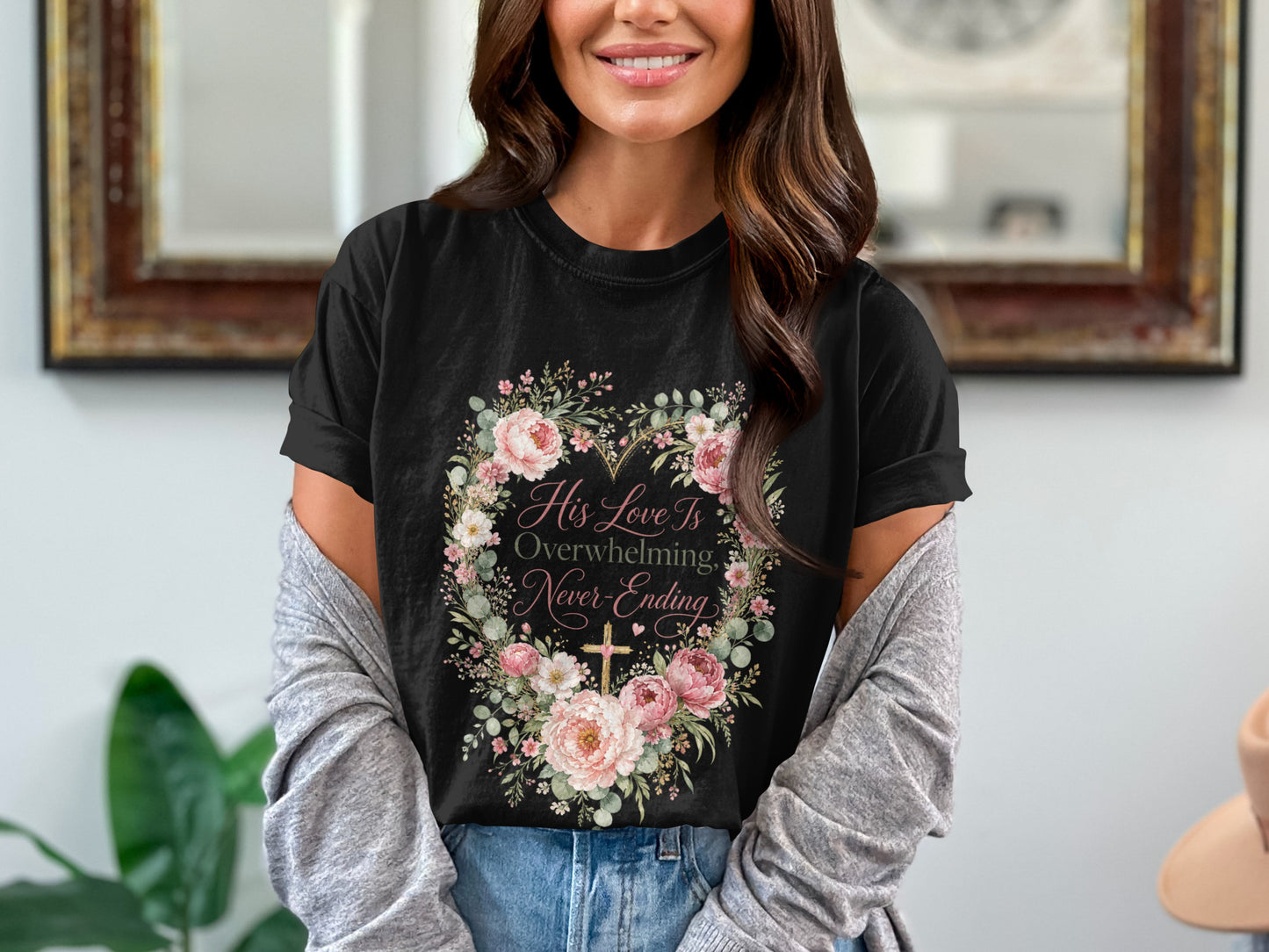 Black t-shirt with floral heart design and text "His Love Is Overwhelming, Never-Ending".
