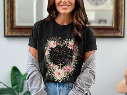 Black t-shirt with floral heart design and text "His Love Is Overwhelming, Never-Ending".