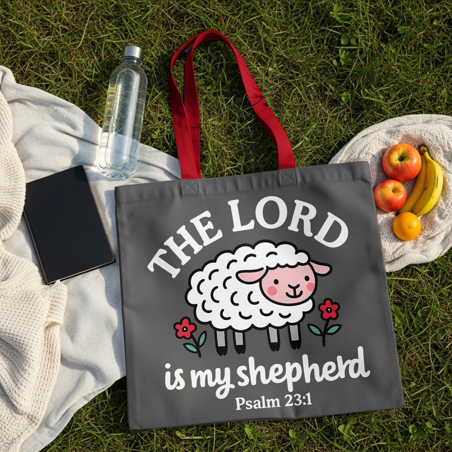 Gray tote bag with white text and a cartoon sheep saying "The Lord is my shepherd Psalm 23:1".