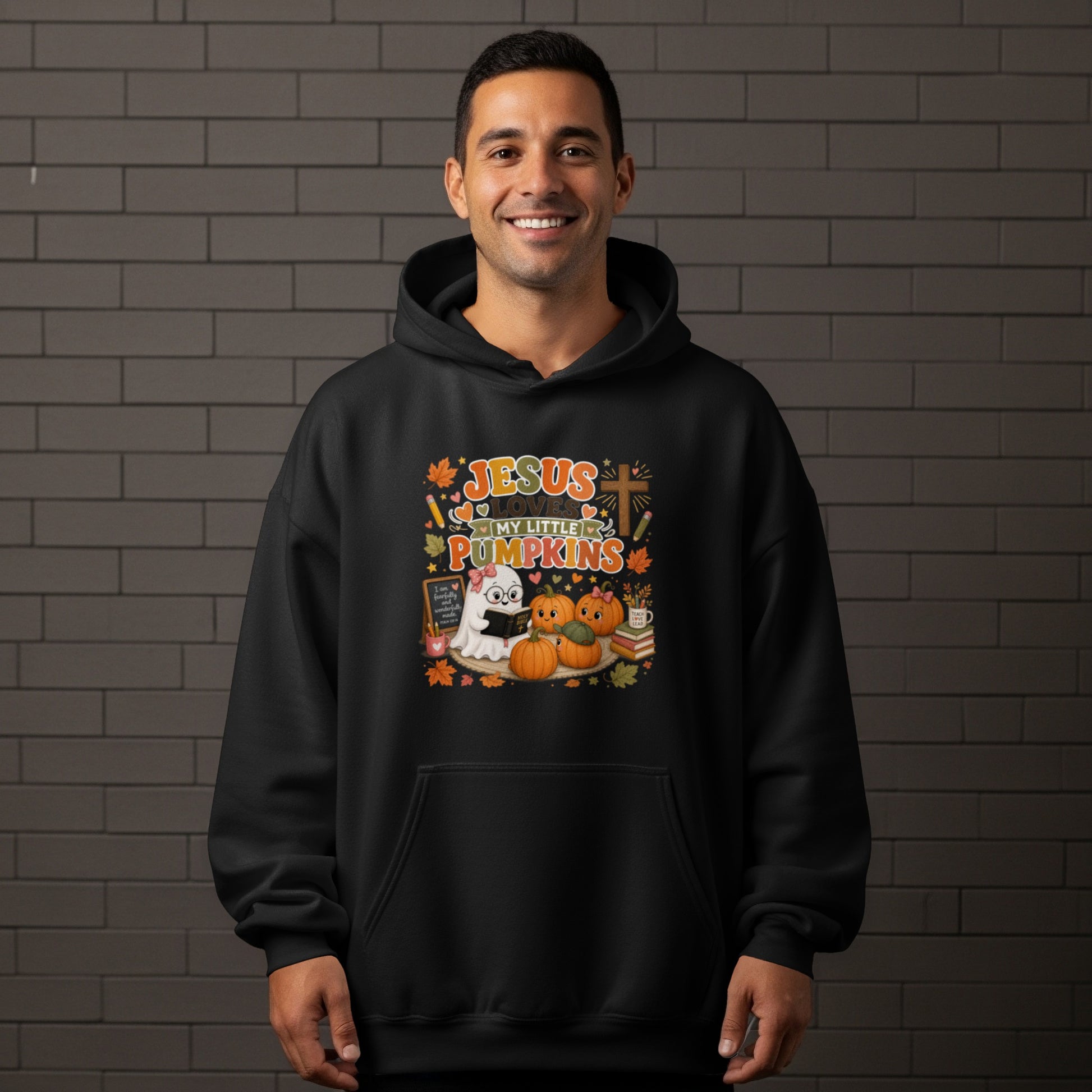 Black hoodie with "Jesus Loves My Little Pumpkins" graphic featuring a ghost and pumpkins.