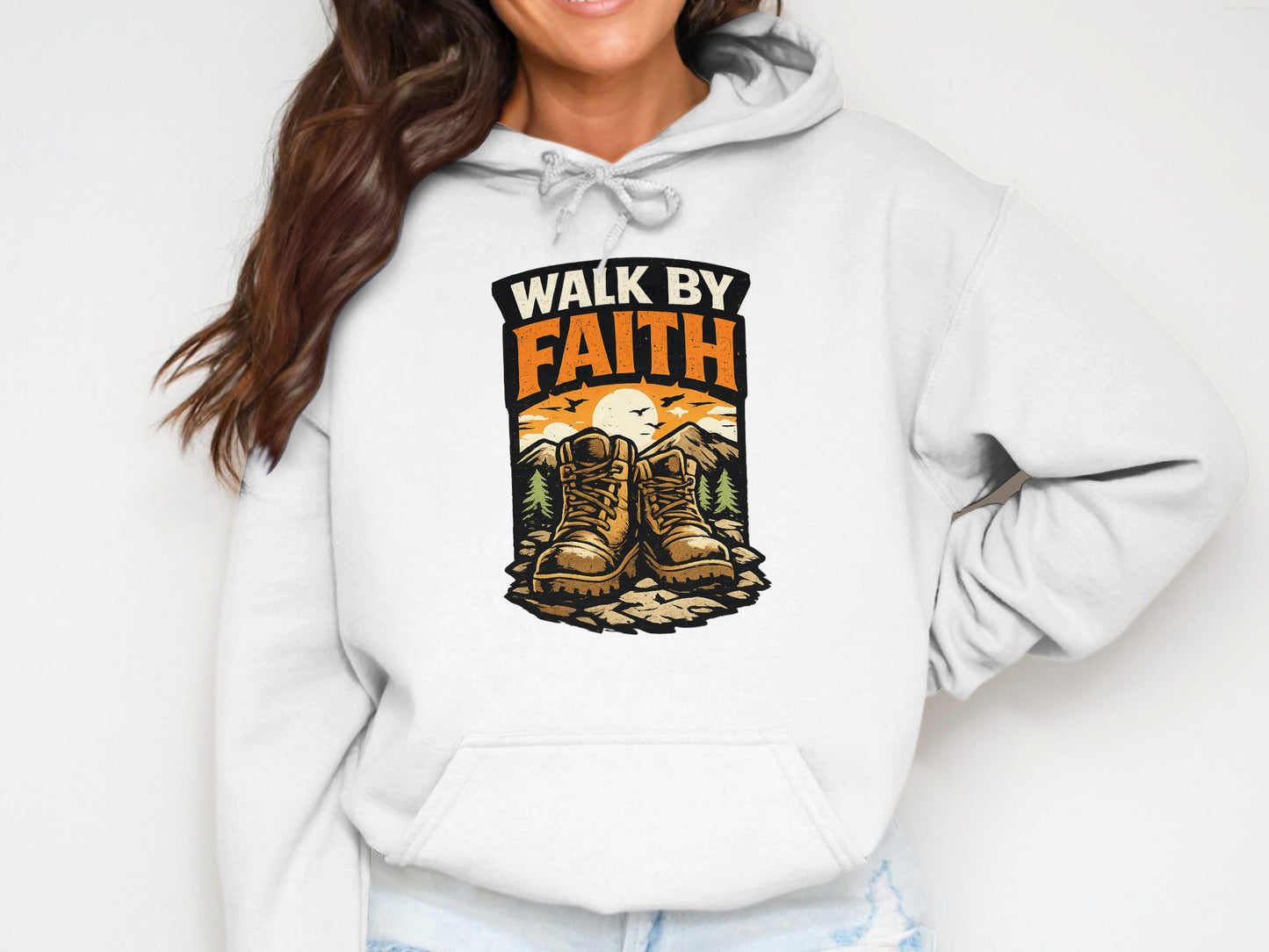 White hoodie with "Walk by Faith" text and hiking boots illustration.