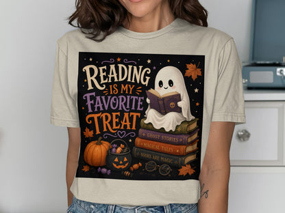 Ghost reading on books, "Reading Is My Favorite Treat" text, Halloween theme.
