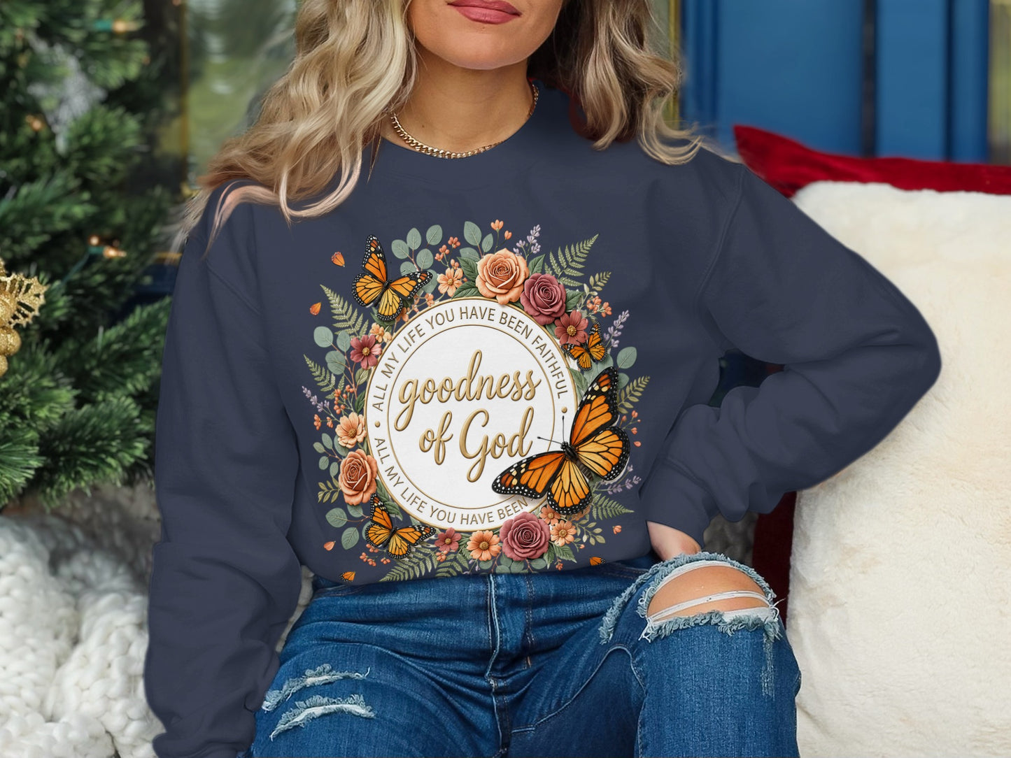 Dark blue sweatshirt with "Goodness of God" and Bible verse in a floral circle.