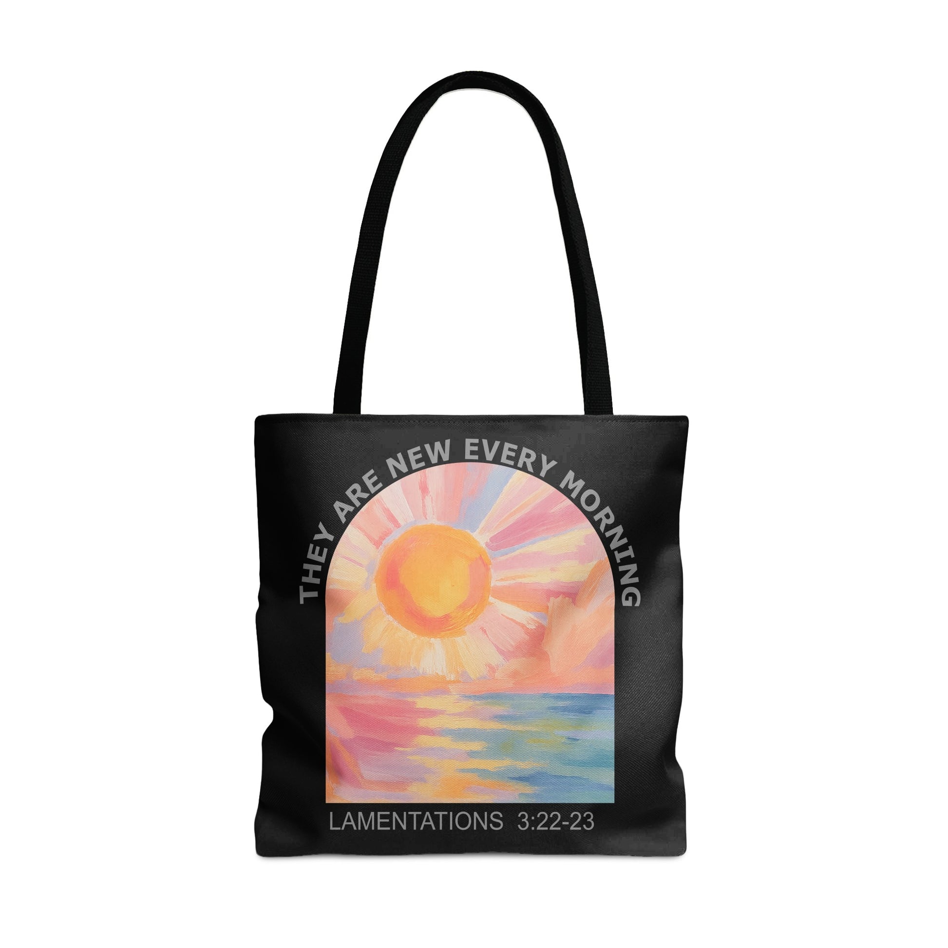 Black tote bag with sunrise art and text "LAMENTATIONS 3:22-23".