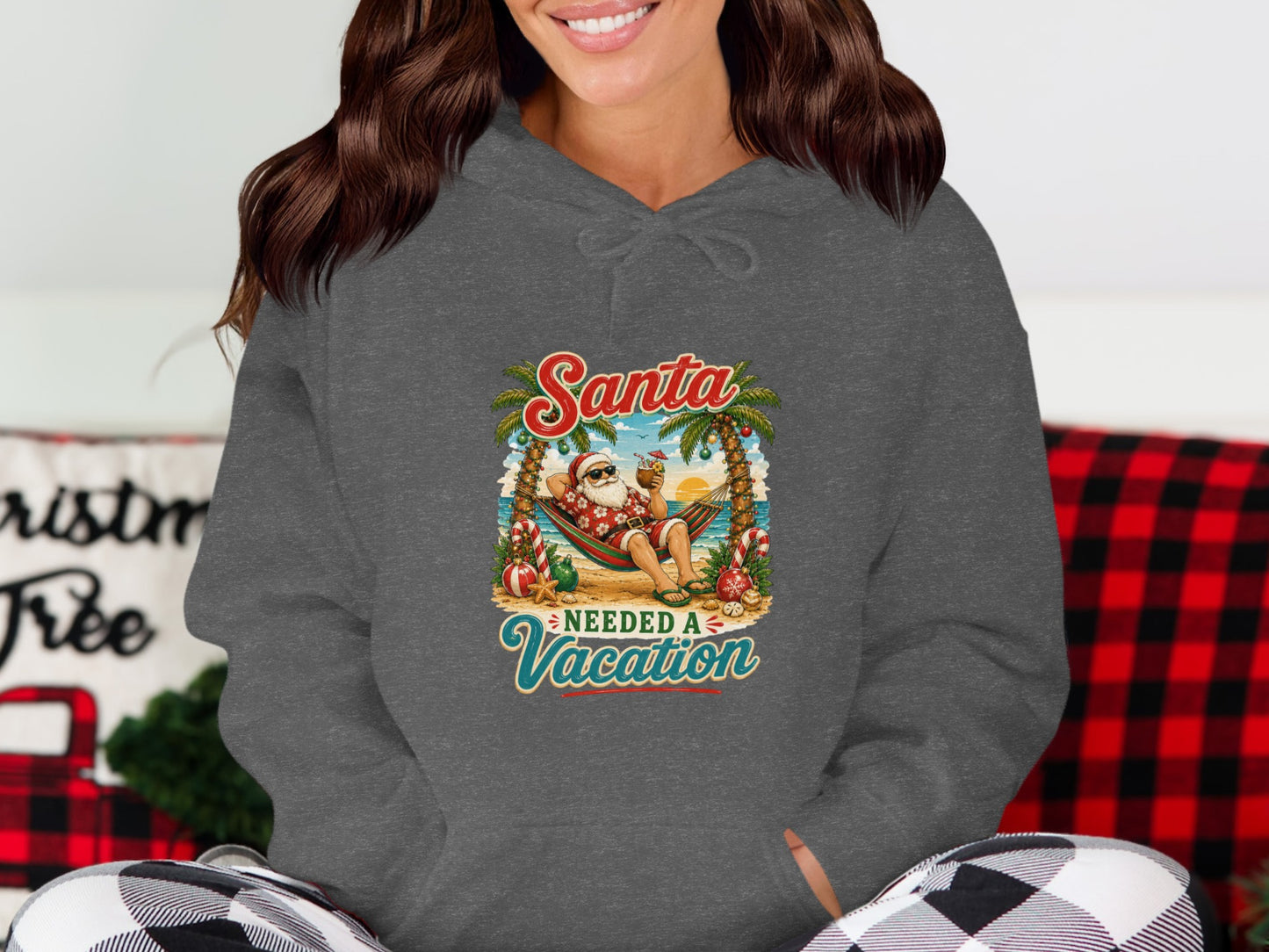 Santa needs a vacation graphic on a gray hoodie with palm trees and a hammock.
