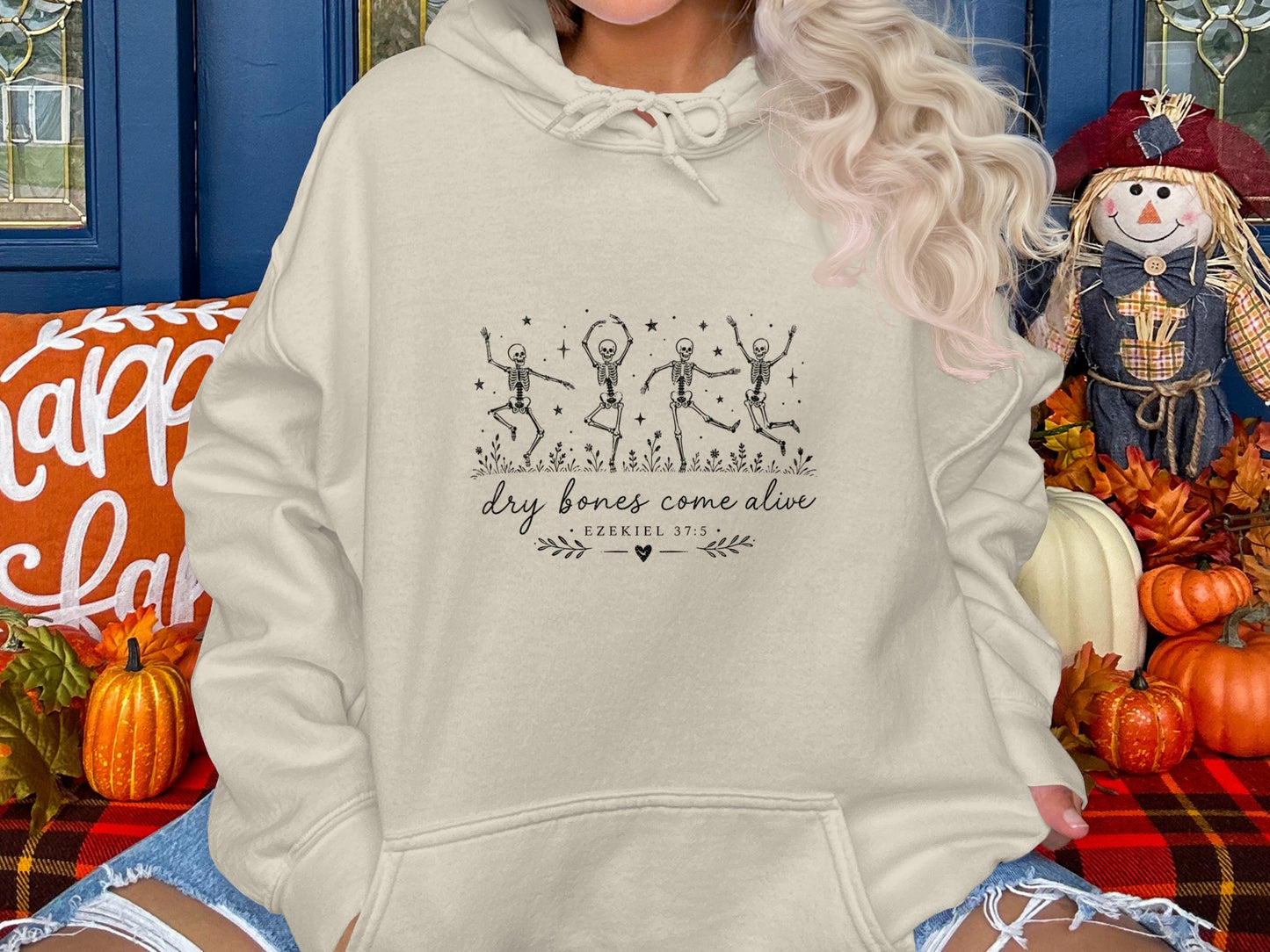 Cream hoodie with dancing skeletons and "dry bones come alive Ezekiel 37:5" text.