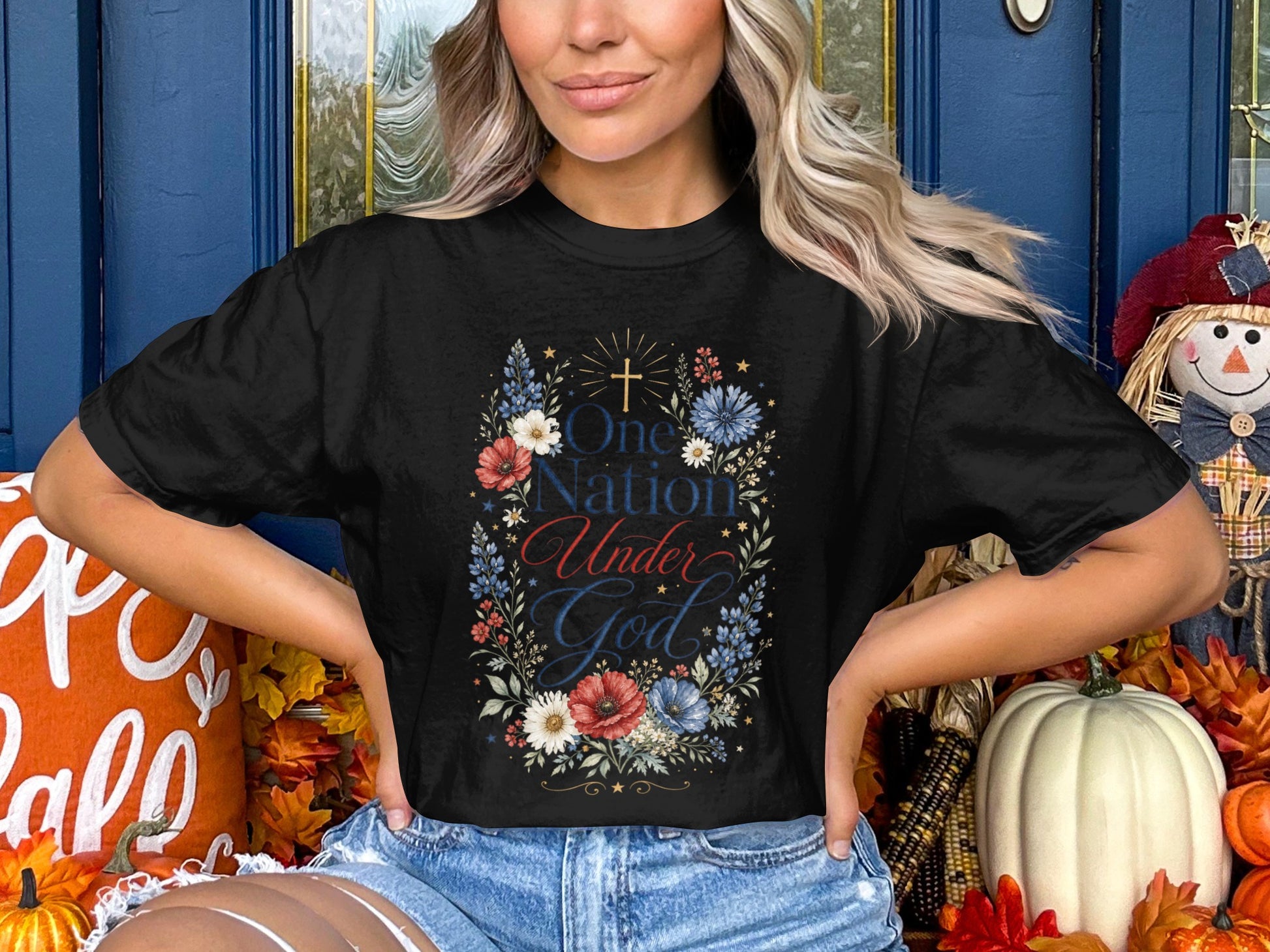 Black t-shirt with "One Nation Under God" text and floral design.