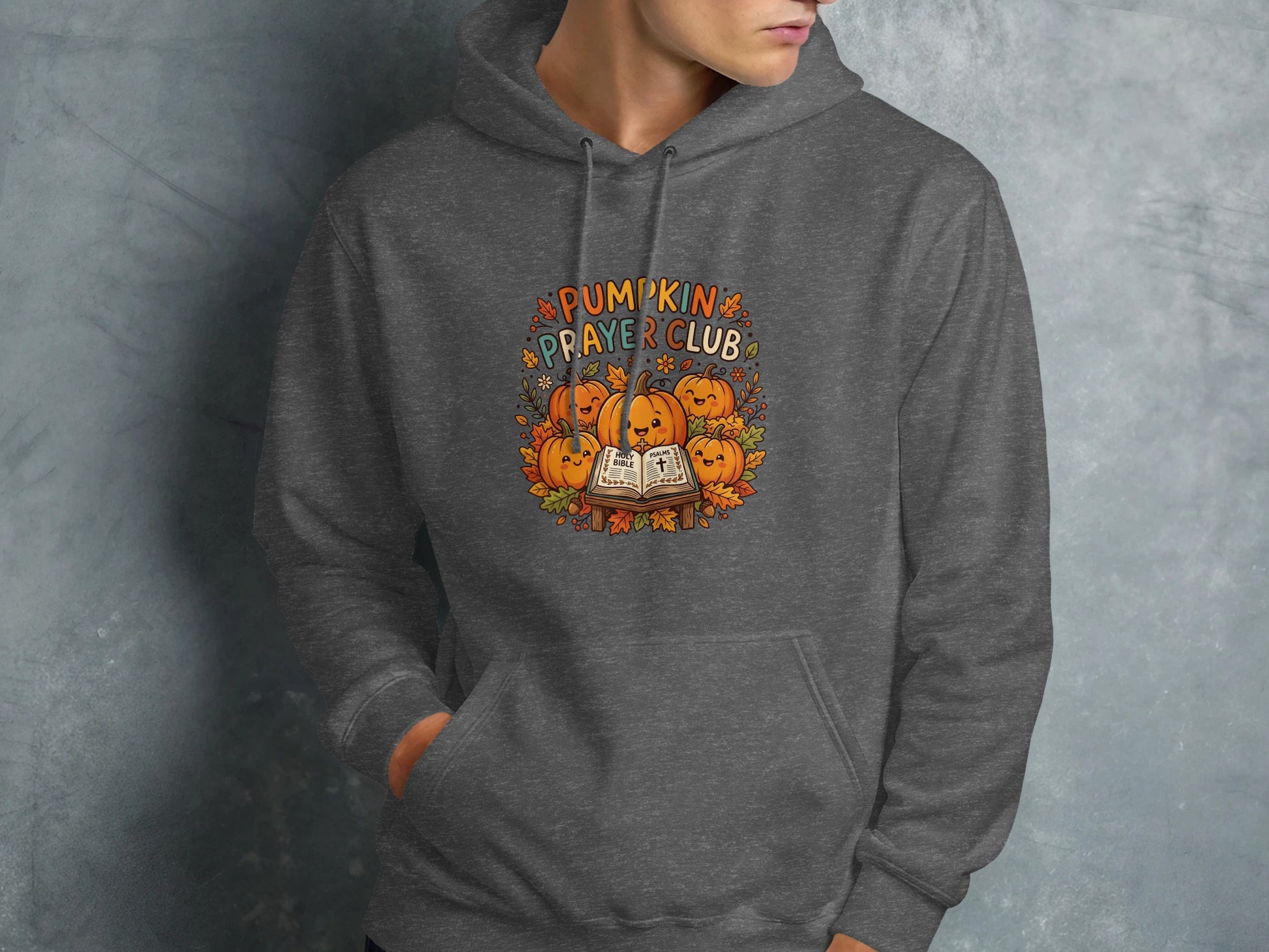 Dark grey hoodie with "Pumpkin Prayer Club" text and pumpkins.