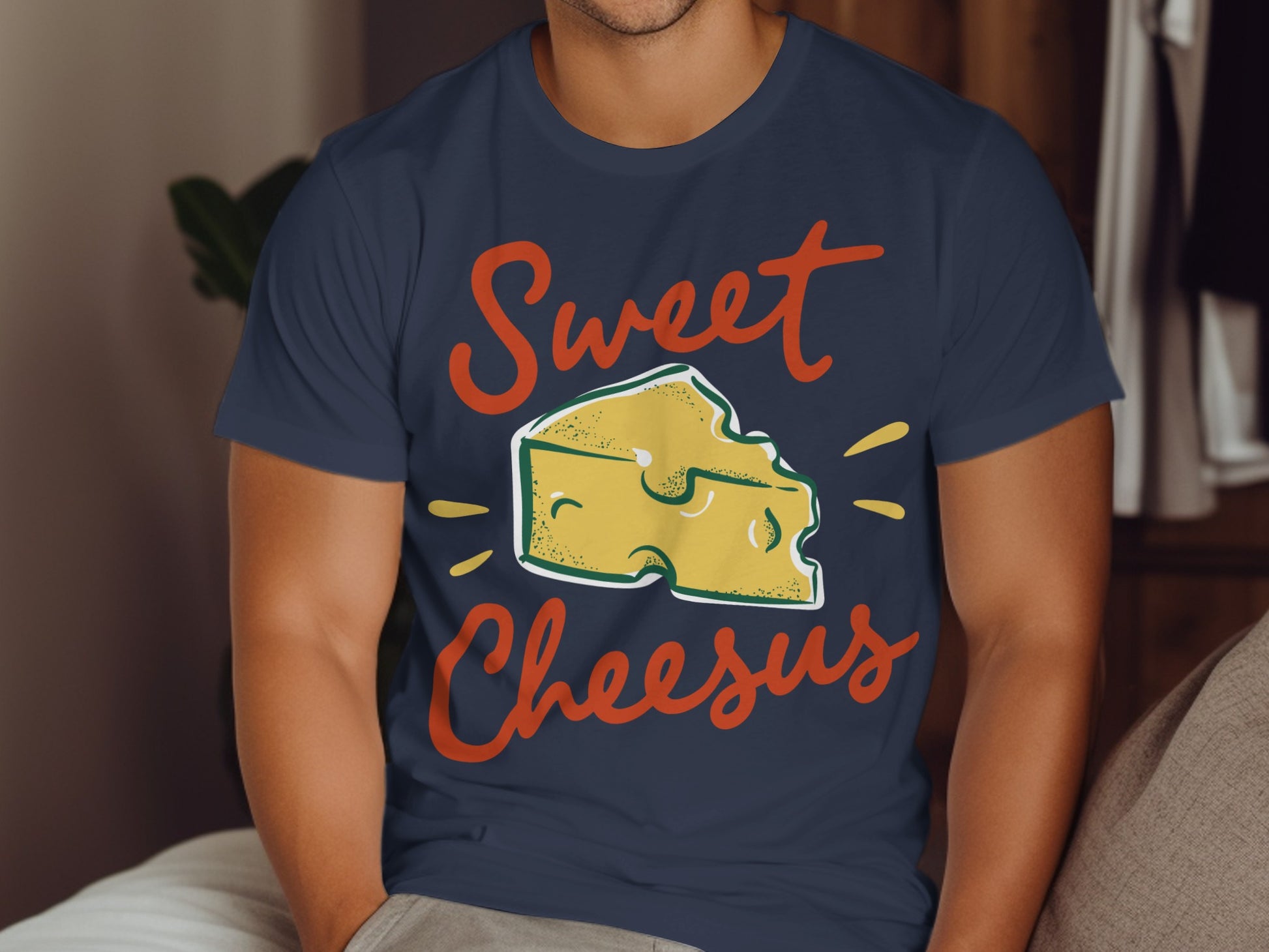 Navy t-shirt with "Sweet Cheesus" text and a cartoon cheese wedge graphic.