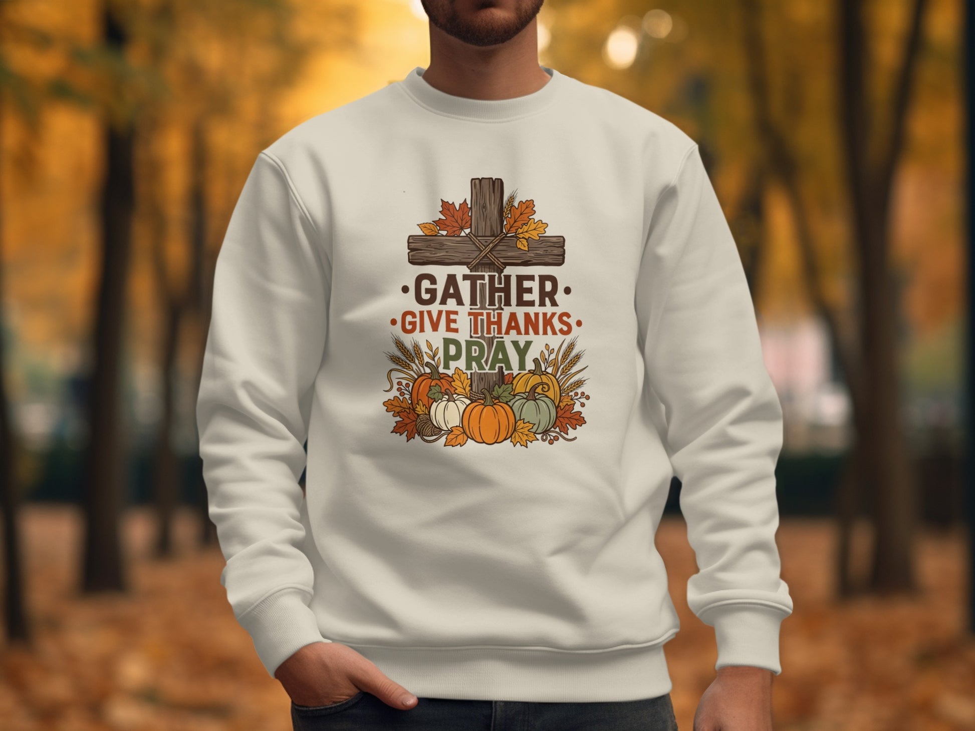 White sweatshirt with "Gather, Give Thanks, Pray" text and autumn pumpkins.