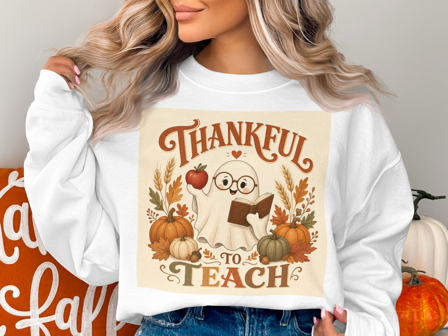 Ghost holding apple and book, surrounded by pumpkins, text says "Thankful to Teach".