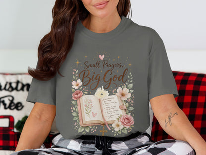 "Small Prayers, Big God" graphic with an open book, flowers, and prayer on a gray t-shirt.