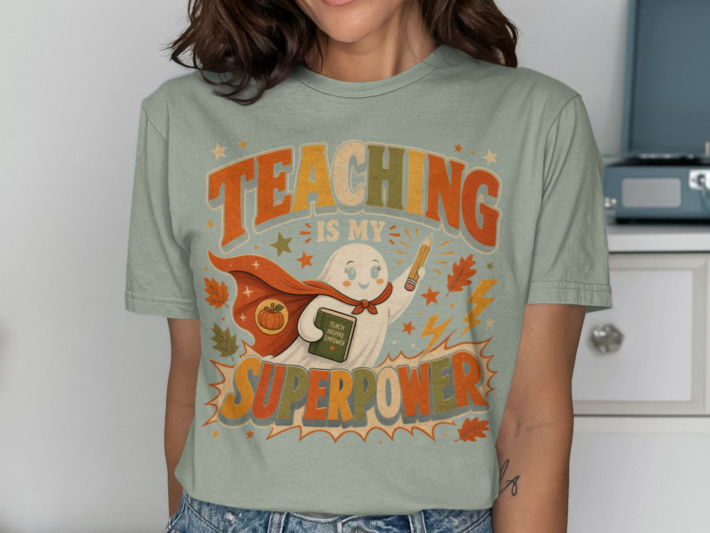 Ghost in cape with pencil and book, "Teaching is my superpower" text.