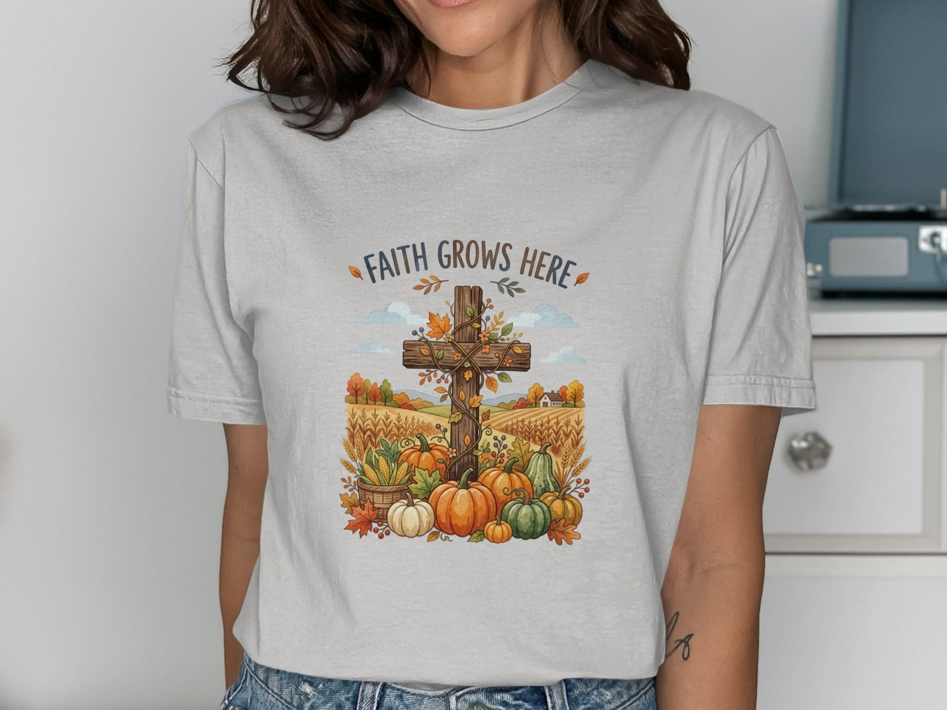 Cross with pumpkins and autumn harvest against a field background.