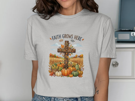 Cross with pumpkins and autumn harvest against a field background.