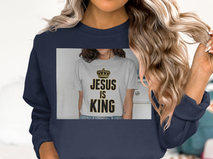 Navy sweatshirt with "Jesus is King" text on a grey t-shirt.
