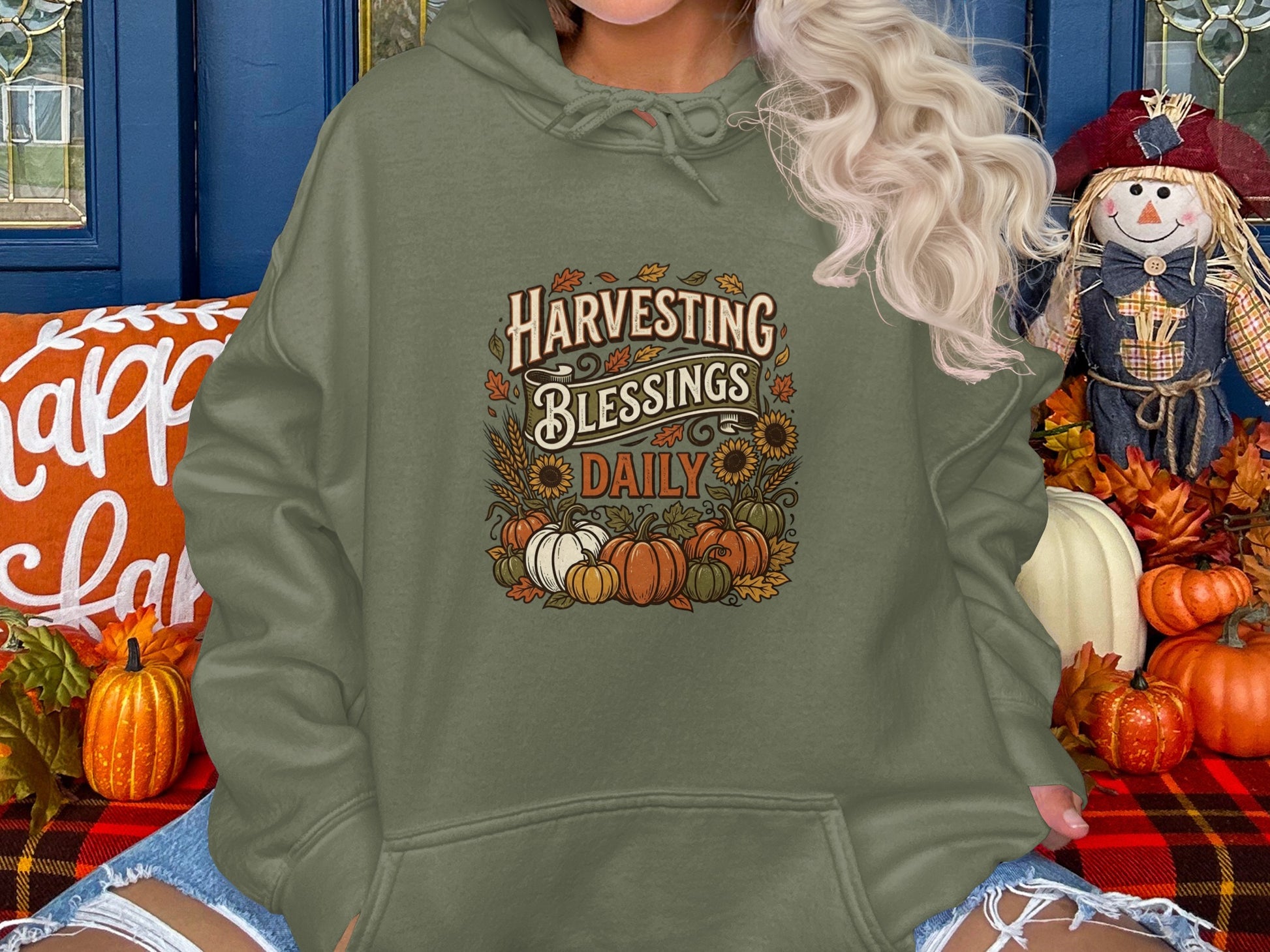 Green hoodie with "Harvesting Blessings Daily" text and pumpkins.