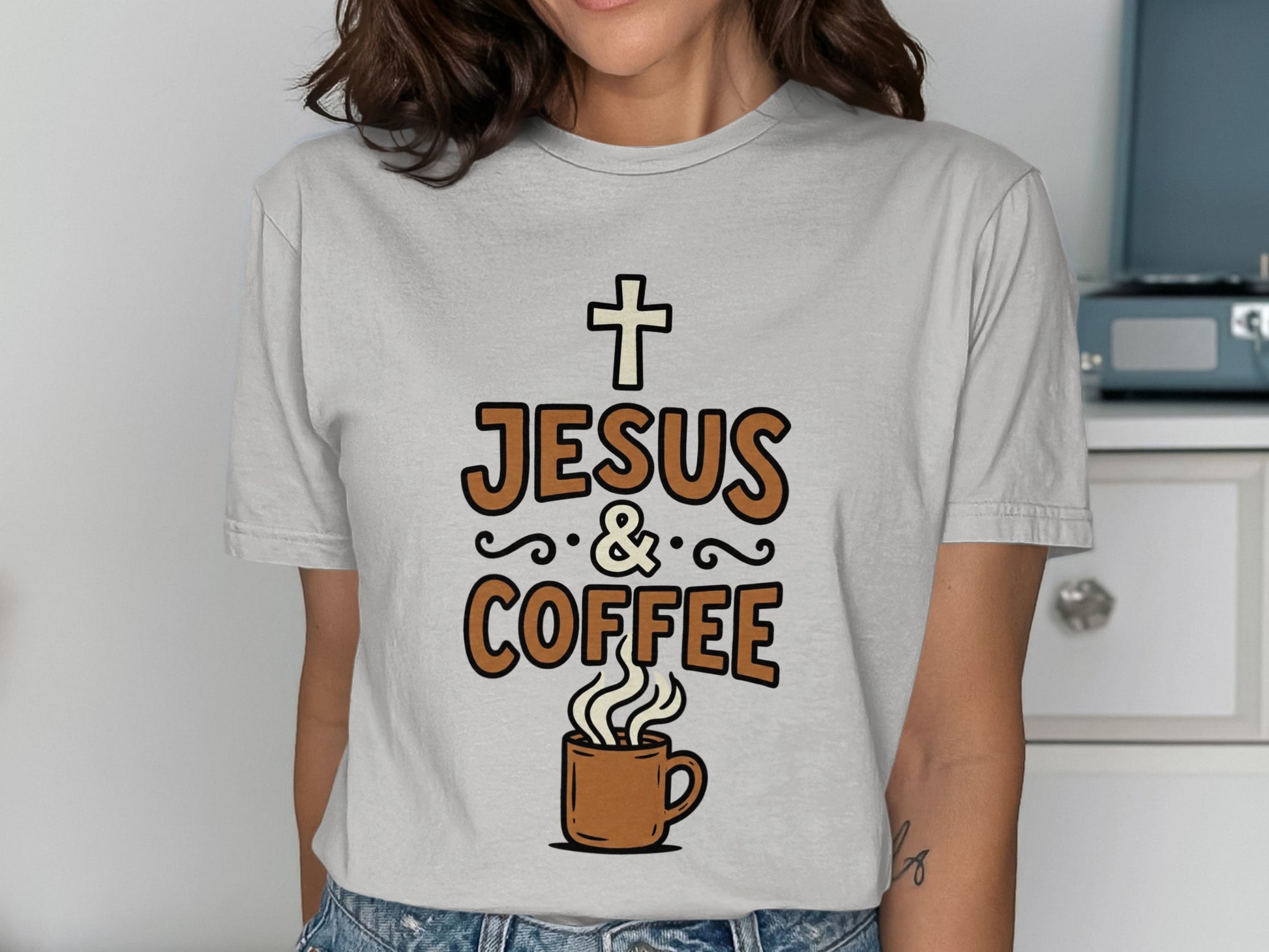 Gray t-shirt with "JESUS & COFFEE" text and a cross above a coffee mug.