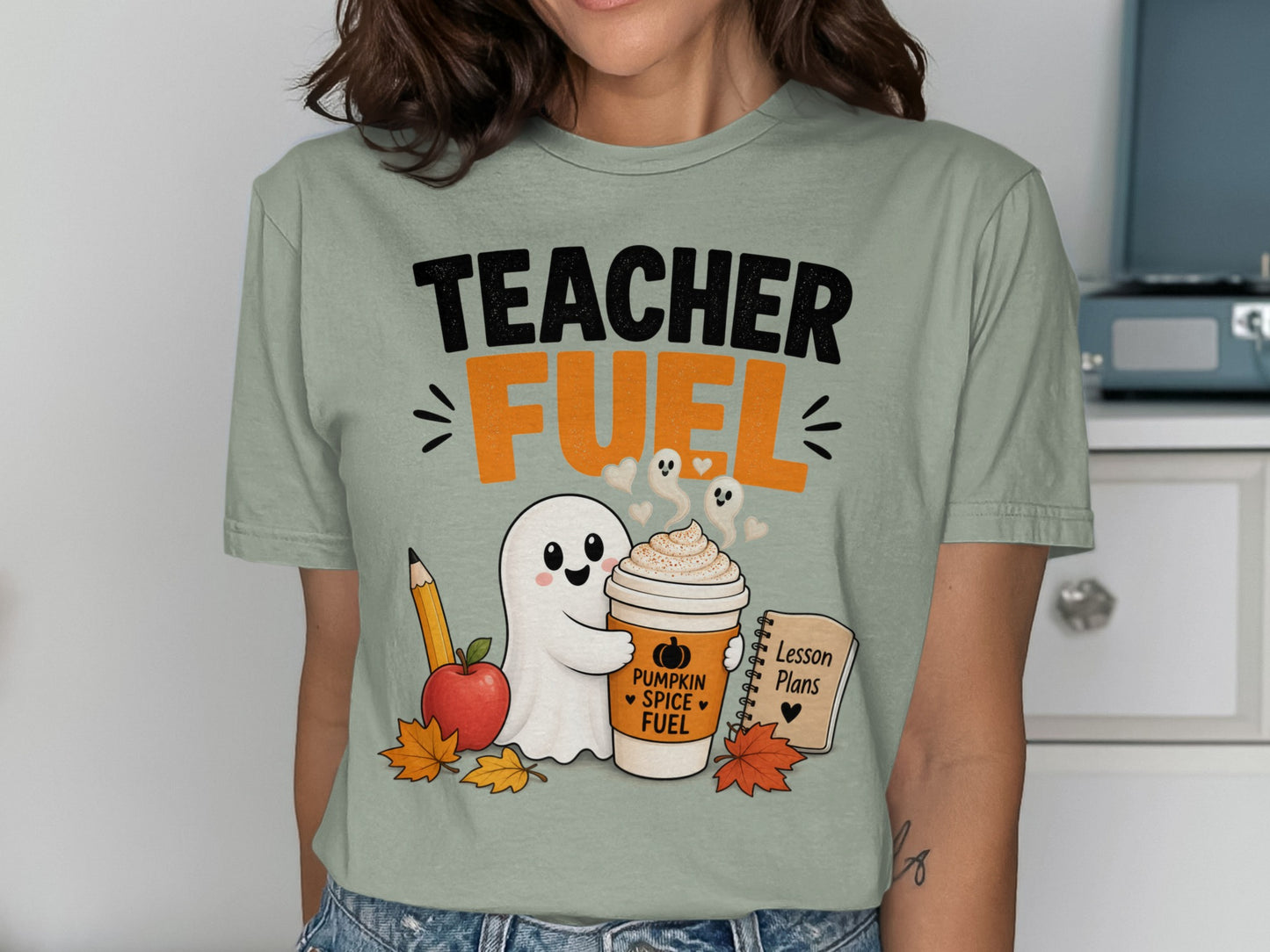 Teacher Fuel text with ghost holding pumpkin spice coffee, apple, pencil, and lesson plans.