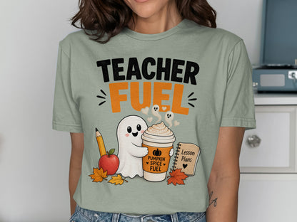 Teacher Fuel text with ghost holding pumpkin spice coffee, apple, pencil, and lesson plans.