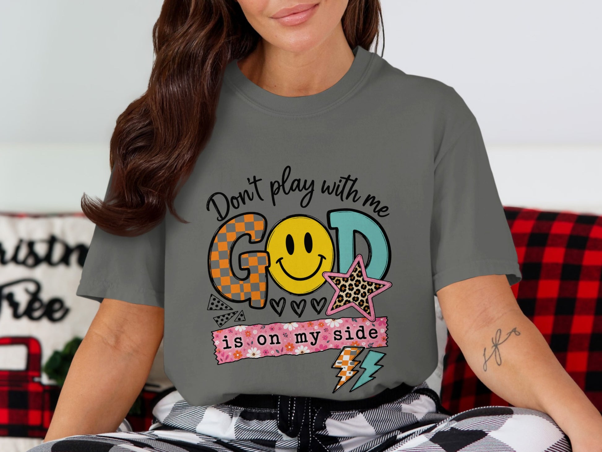 Graphic tee with "Don't play with me GOD is on my side" text and smiley face.