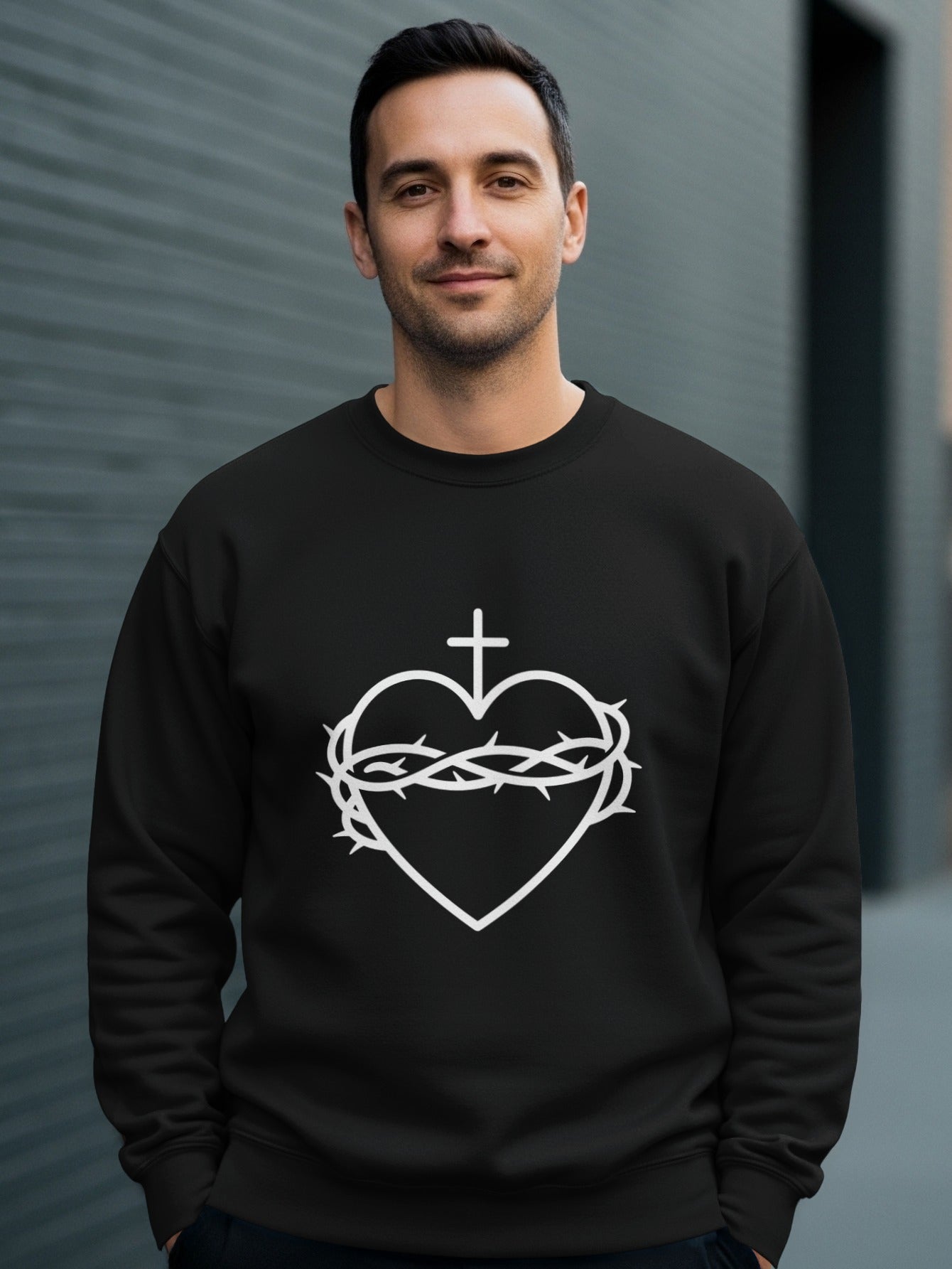 Black sweatshirt with white Sacred Heart of Jesus graphic.