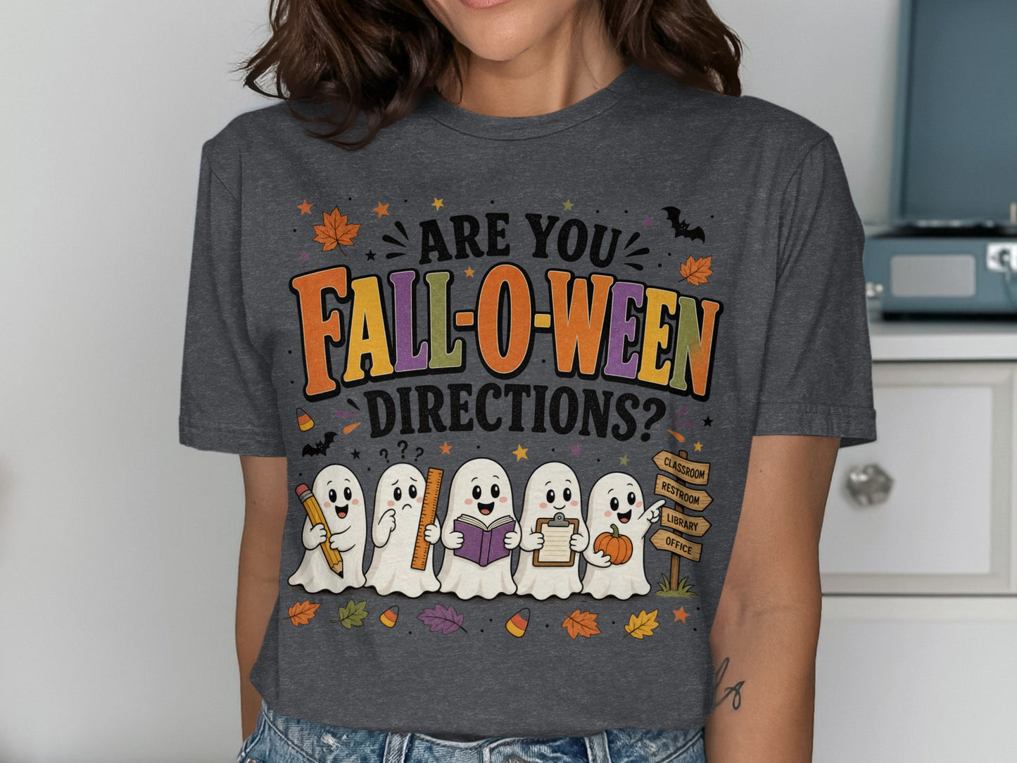 T-shirt with ghosts holding school supplies, text "ARE YOU FALL-O-WEEN DIRECTIONS?"
