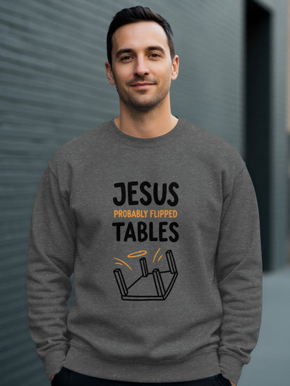 Man wearing gray sweatshirt with "JESUS PROBABLY FLIPPED TABLES" text.