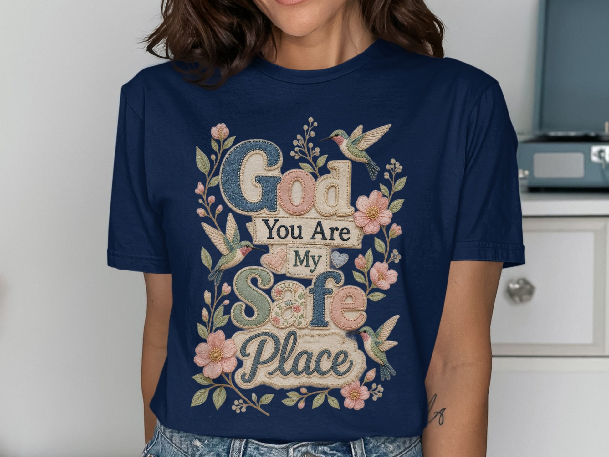 Navy t-shirt with "God You Are My Safe Place" text and floral hummingbird design.