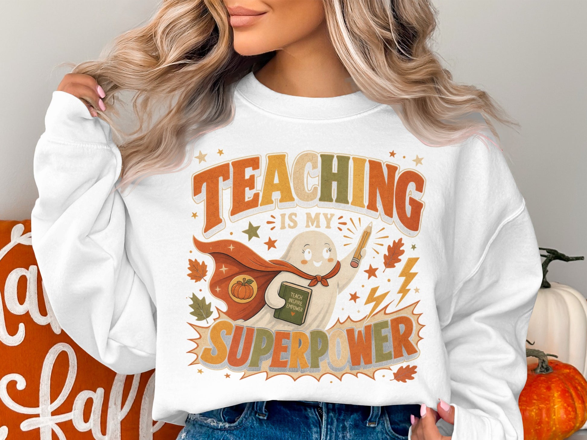 White sweatshirt with ghost design: "Teaching is my superpower"