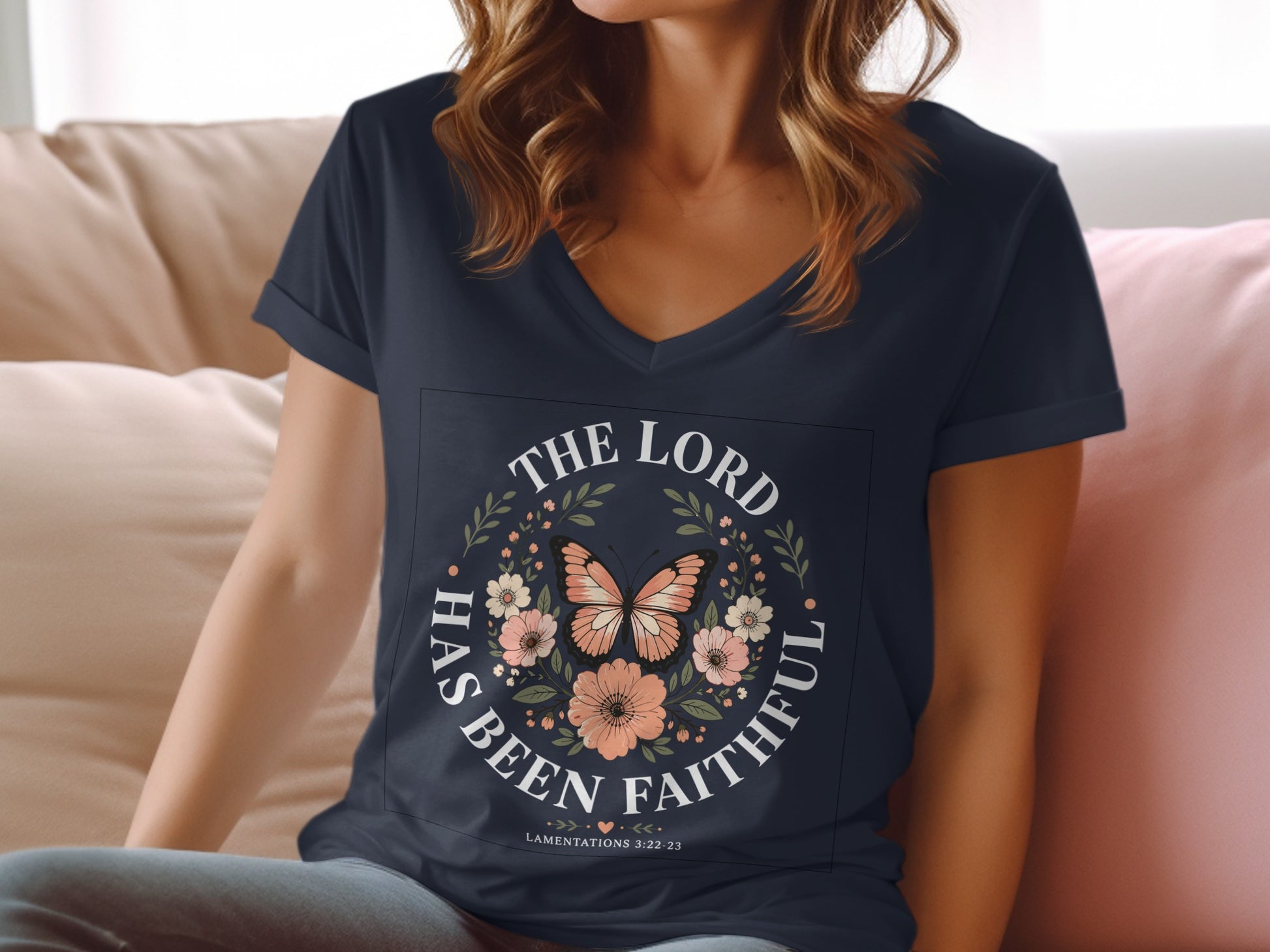 Navy v-neck t-shirt with floral and butterfly design and text "The Lord Has Been Faithful".