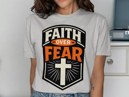 Faith Over Fear graphic t-shirt with a cross design.