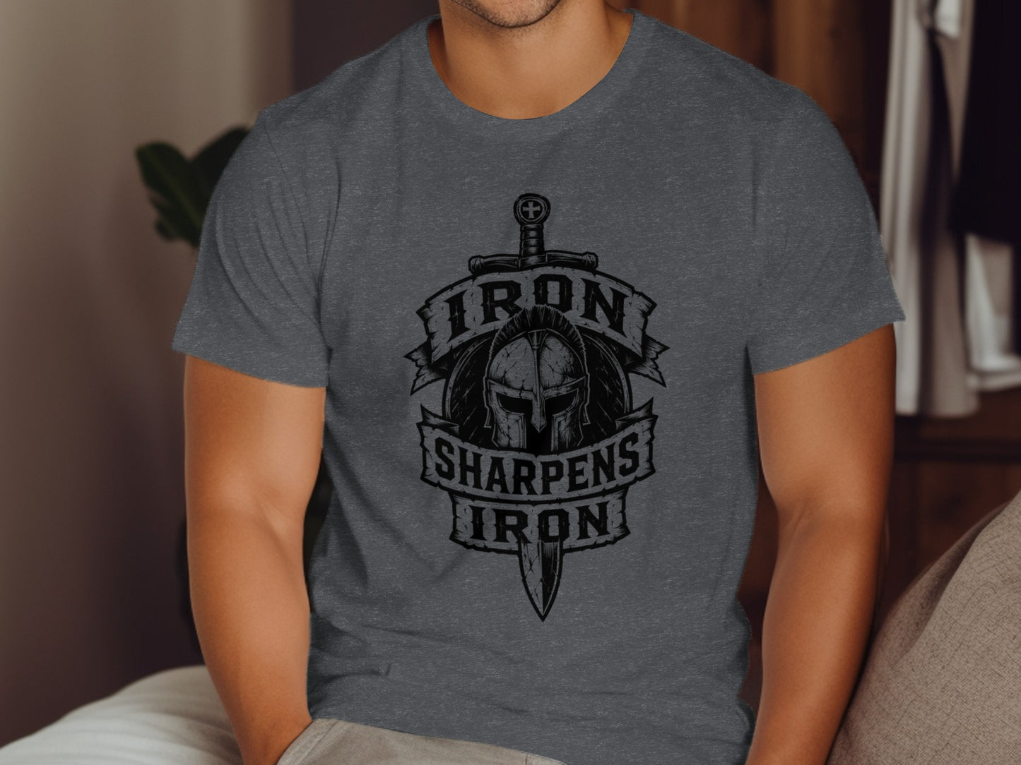 Dark gray t-shirt with "IRON SHARPENS IRON" text and helmet graphic.